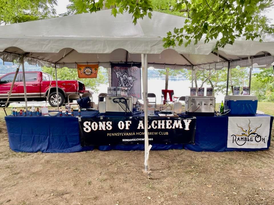 The Sons of Alchemy tent set up before the brewfest